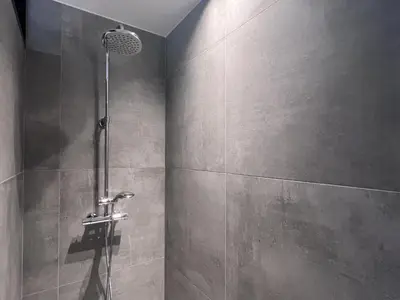 a bathroom with a shower with a shower head at Bigaro II in Heers