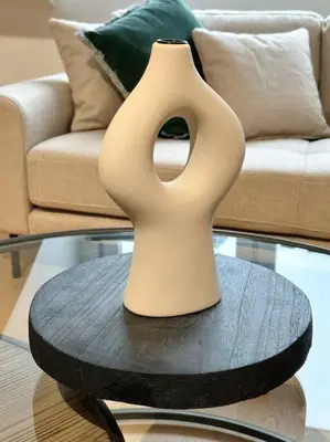 a white vase sitting on top of a table at Duplex hyper centre in Liège