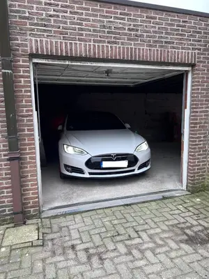 a white car is parked inside of a garage at Red cross street in Lommel