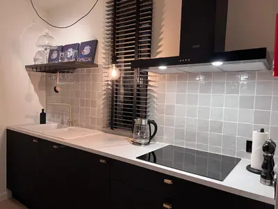 a kitchen with a sink and a counter top at Red cross street in Lommel
