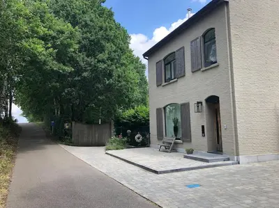 a house with a bench in front of it at Casa Sandra Elisa in Maasmechelen