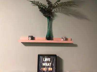 a vase with a plant on a shelf on a wall at Casa Sandra Elisa in Maasmechelen