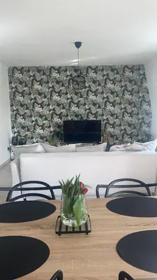 a dining room with a table and chairs at Le cocon de la belle liégeoise in Liège
