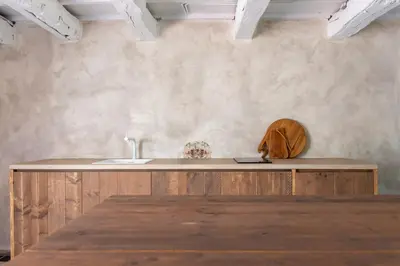 a kitchen with a wooden counter and a sink at Ca'Triz in Borgloon