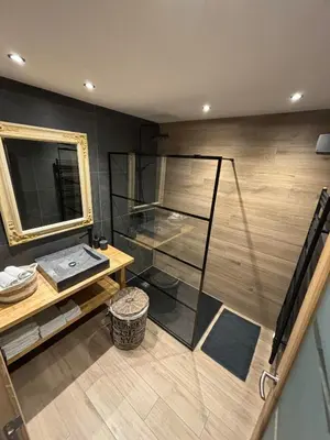 a room with a mirror and a table and a counter at Guesthouse 66 in Lommel
