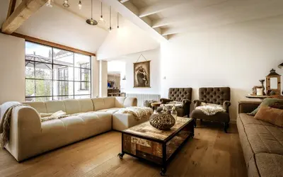 a living room with a couch and a table at Vakantiehuis Zand7 in Lommel