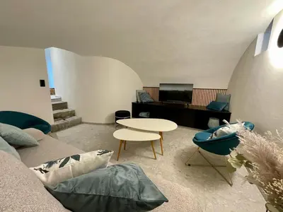 a living room with a couch and a table at Gite de Clermont in Thimister