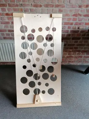 a wooden box with a bunch of dots on it at Belevingshoeve 