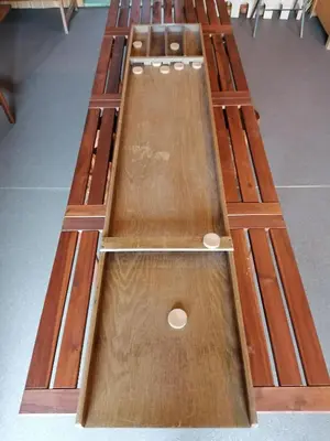 a row of wooden tables sitting next to each other at Belevingshoeve 