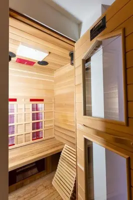 a room with wooden walls and a small room with a room at Arthurs Palace in Heusden - Zolder