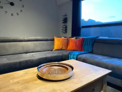 a bowl on a table in front of a couch at Casper House, Near Maastricht in Lanaken