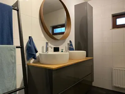 a bathroom with a sink and a mirror at Casper House, Near Maastricht in Lanaken